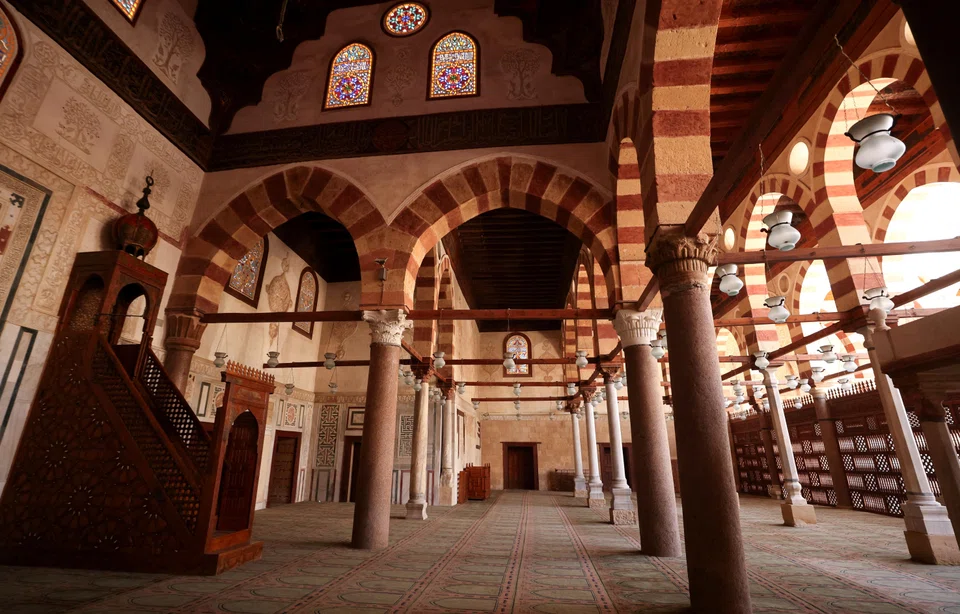 The mosque’s main entrance is decorated in ornate inscriptions and fine marble.