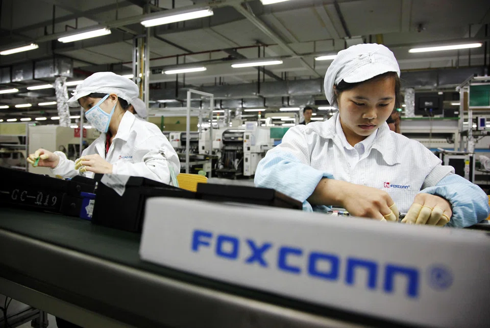 Assembly line employees at Foxconn's plant in Shenzhen, China, 2013. China now no longer offers production advantages, and having most of your workforce in one place has turned from strength to weakness. What replaces Foxconn’s former mega-factory strategy will have huge ramifications for multibillion dollar industries, geopolitics, and the world’s largest economies.