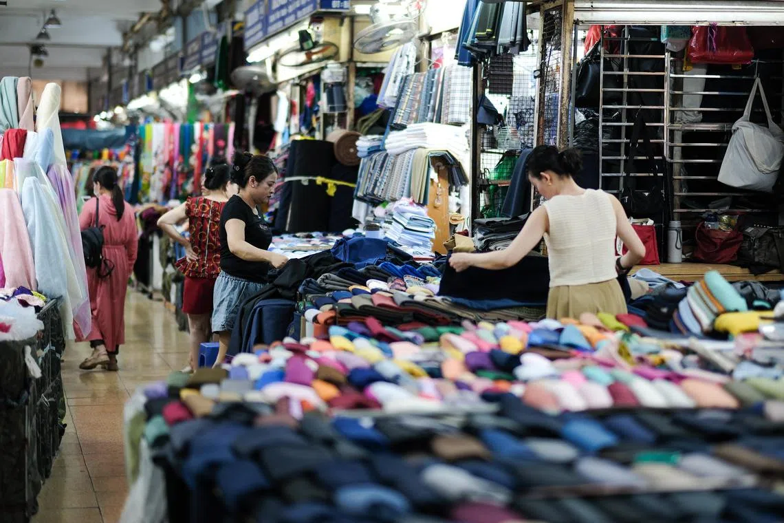 A market in Hanoi, Vietnam. With a population of over 690 million – or around 8% of the world's population – Asean accounts for over 3.5% of global gross domestic product and 7.4% of global exports.