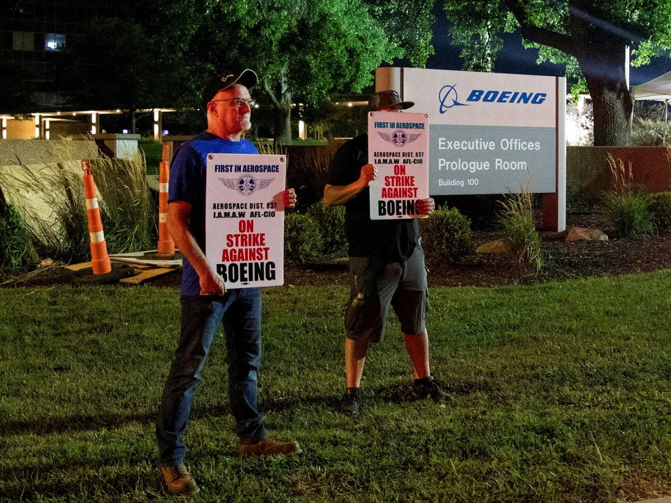 Workers protest during a walkout by members of the International Association of Machinists and Aerospace Workers (IAM) over contract negotiations, outside Boeing company's facility, Berkeley, Missouri, Aug 4, 2025. 