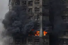 The fire may have been caused by a “grossly negligent” construction firm using unsafe materials, police said.