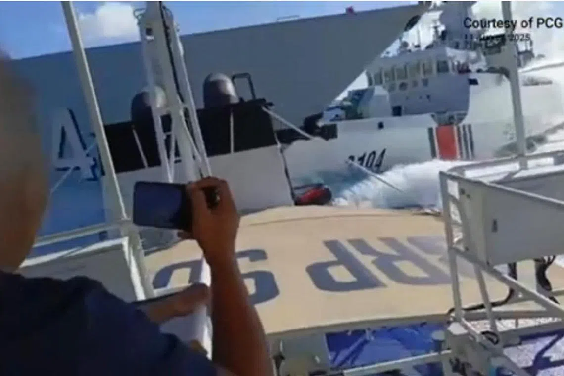 A Chinese Navy vessel (left) and a Chinese Coast Guard ship (right) collide while chasing a Philippines patrol boat near Scarborough Shoal in the disputed South China Sea, Aug 11, 2025.