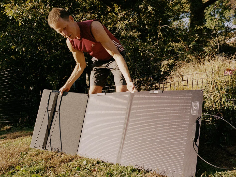 Joshua Spodek packing up his solar panel after four hours of charging in Washington Square Park in New York on Oct 22, 2024. In May 2022, Spodek disconnected his Greenwich Village apartment from the electrical grid to see if he could live unplugged for a year. 