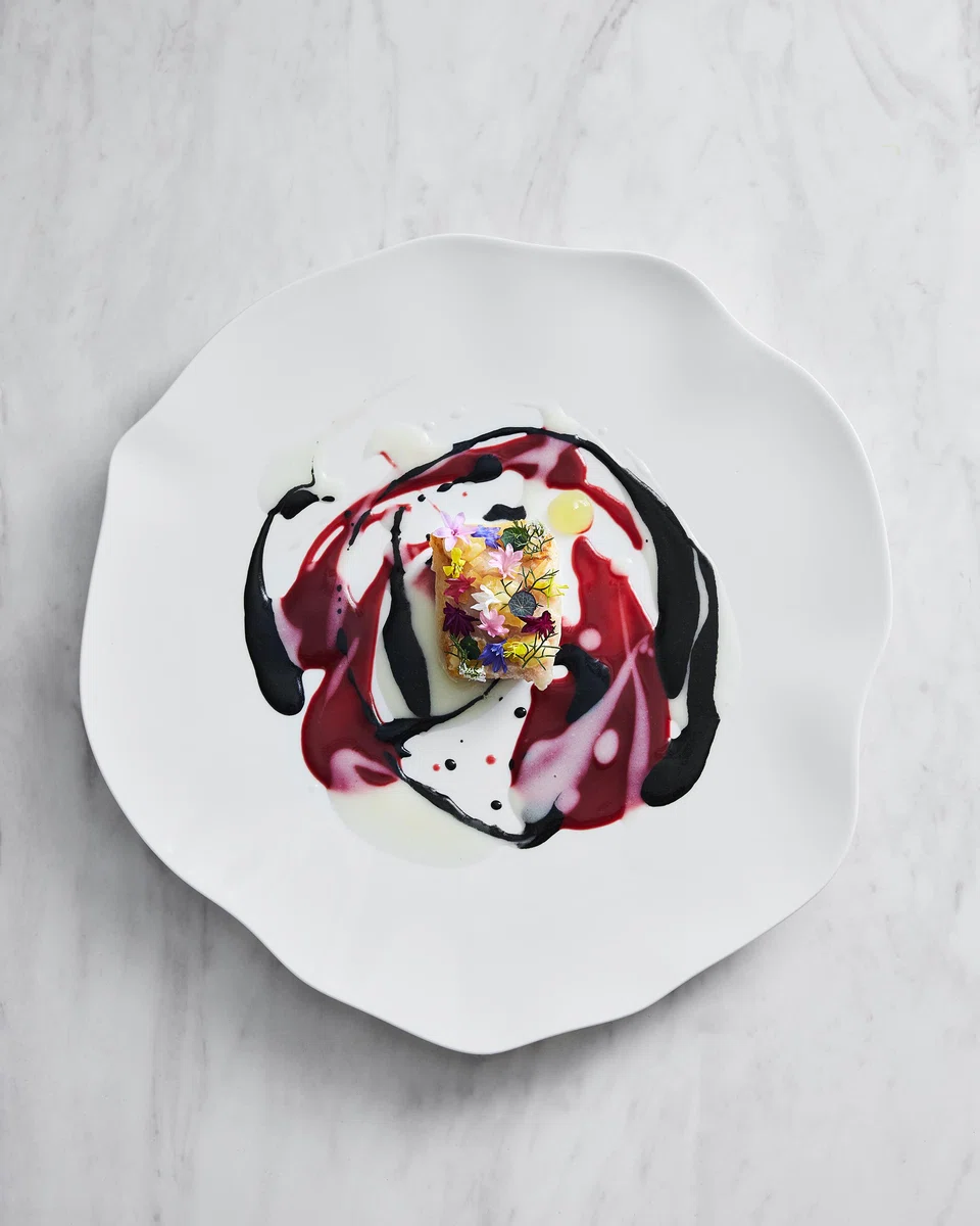 Seared ginpo in a splash of colourful sauces.