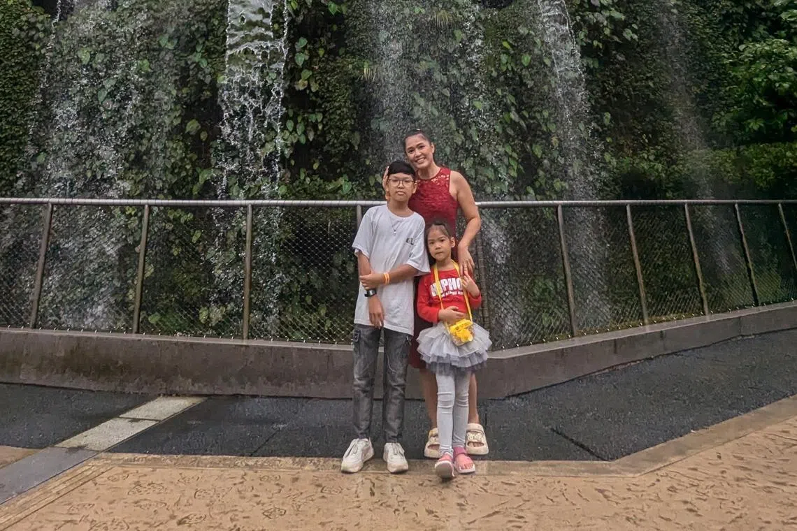 Rathanaa, 46, says that the Families100 programme by OCBC has benefited her children, aged 7 and 12, respectively. 