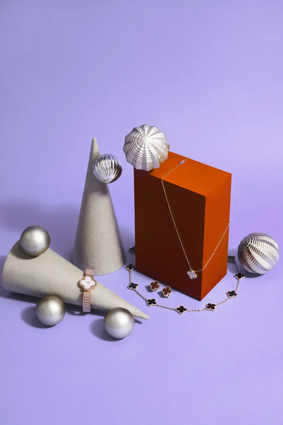 Left to right: Sweet Alhambra watch in rose gold with mother-of-pearl dial and Swiss quartz movement (S$41,900); Vintage Alhambra 10-motif necklace in yellow gold with onyx (S$12,100); Vintage Alhambra earrings in yellow gold with carnelian (S$6,400); Vintage Alhambra pendant in rose gold with diamonds (S$11,500)