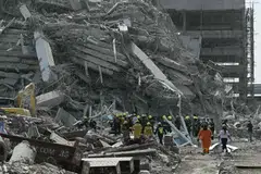 Rescue teams at a construction site where a building collapsed in Bangkok after an earthquake. A powerful earthquake had rocked central Myanmar earlier.