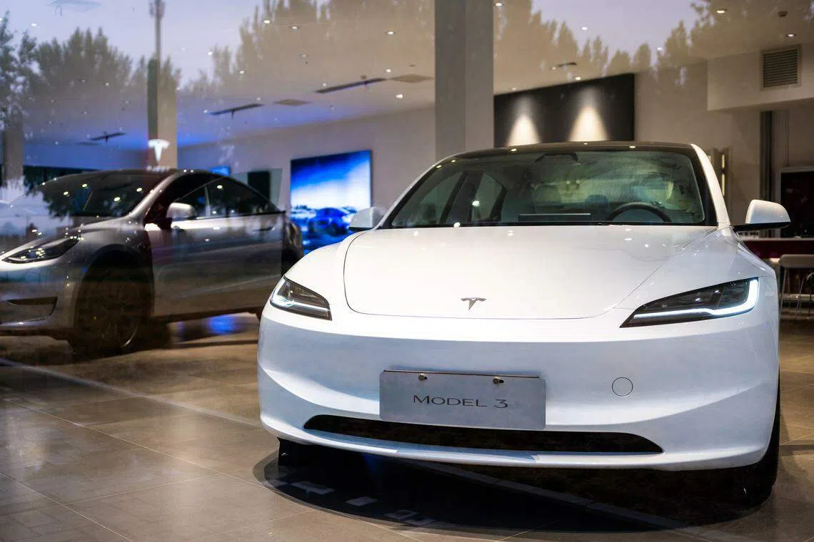 A Tesla Inc. Model 3 electric vehicle at a store in Beijing, China. Photographer: Na Bian/Bloomberg
