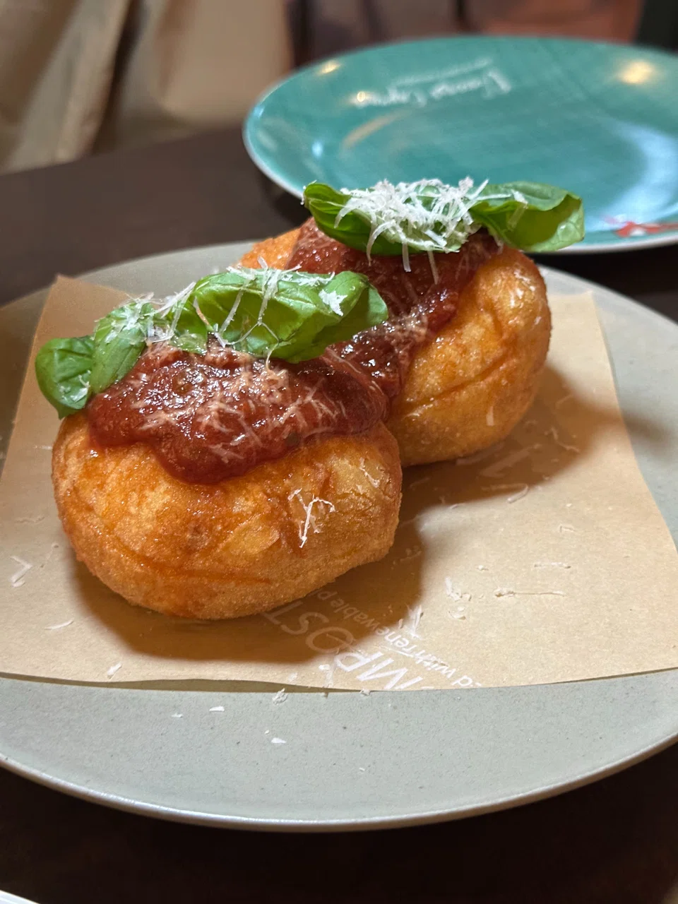 Vincenzo's fried doughnut topped with tomato ragu.