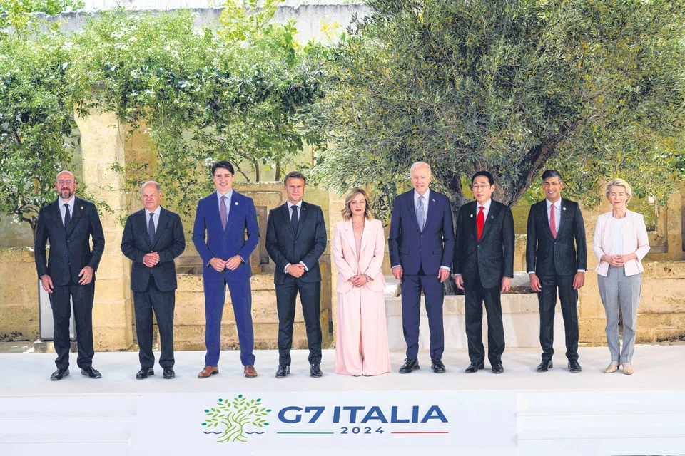 Leaders of the G7,  European Council and European Commission at the start of their summit on Jun 13, in Fasano, Italy.