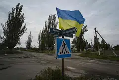 A Ukrainian flag waves on a street of the recently liberated village of Vysokopillya in the Kherson region of Ukraine. Ukraine’s tenacity shows how powerful liberal nationalism can be in the face of an authoritarian threat.