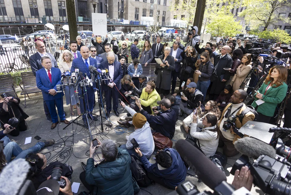 Attorney Arthur Aidala (4th from left) stands with members of Harvey Weinstein's legal team during a press conference in New York, April 25, 2024. The New York State Court of Appeals overturned Weinstein's 2020 rape conviction.