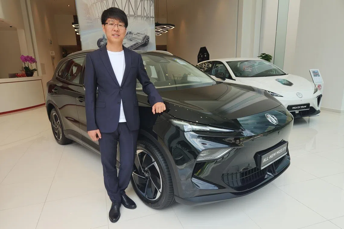 Li Sheng, MG’s overseas brand and marketing director, with the MG S5 electric vehicle that was launched in Singapore on Wednesday (Apr 9). The model will be the brand's "most important" one in sales terms, he says.