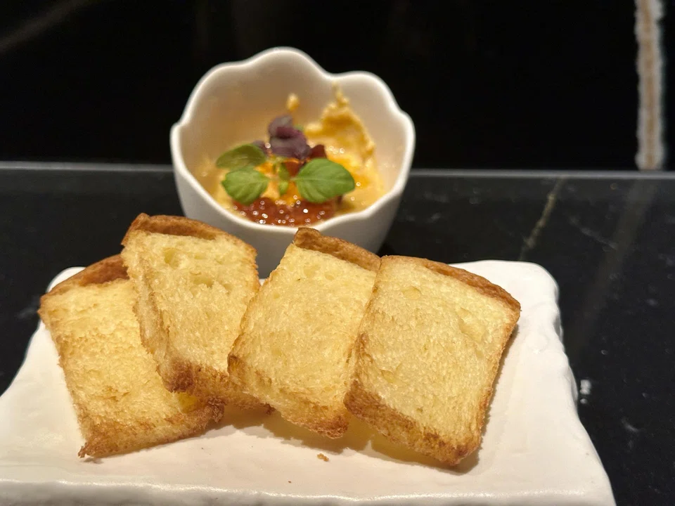 Scrambled egg and uni with toasted brioche.