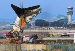 A crane lifts the tail section during the salvage operation of the Jeju Air Boeing 737-800 aircraft which crashed and burst into flames at Muan International Airport, Muan, South Korea, Jan 3, 2025. The closure of Muan International Airport has been extended until Jan 14, the ministry of land said in a statement on Monday.
