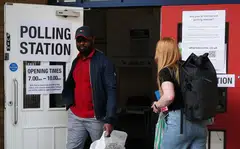 Voters exit a polling station in London. In what was billed as a pivotal moment for the country, 40 per cent of the electorate did not bother to exercise their right to choose an MP or government.