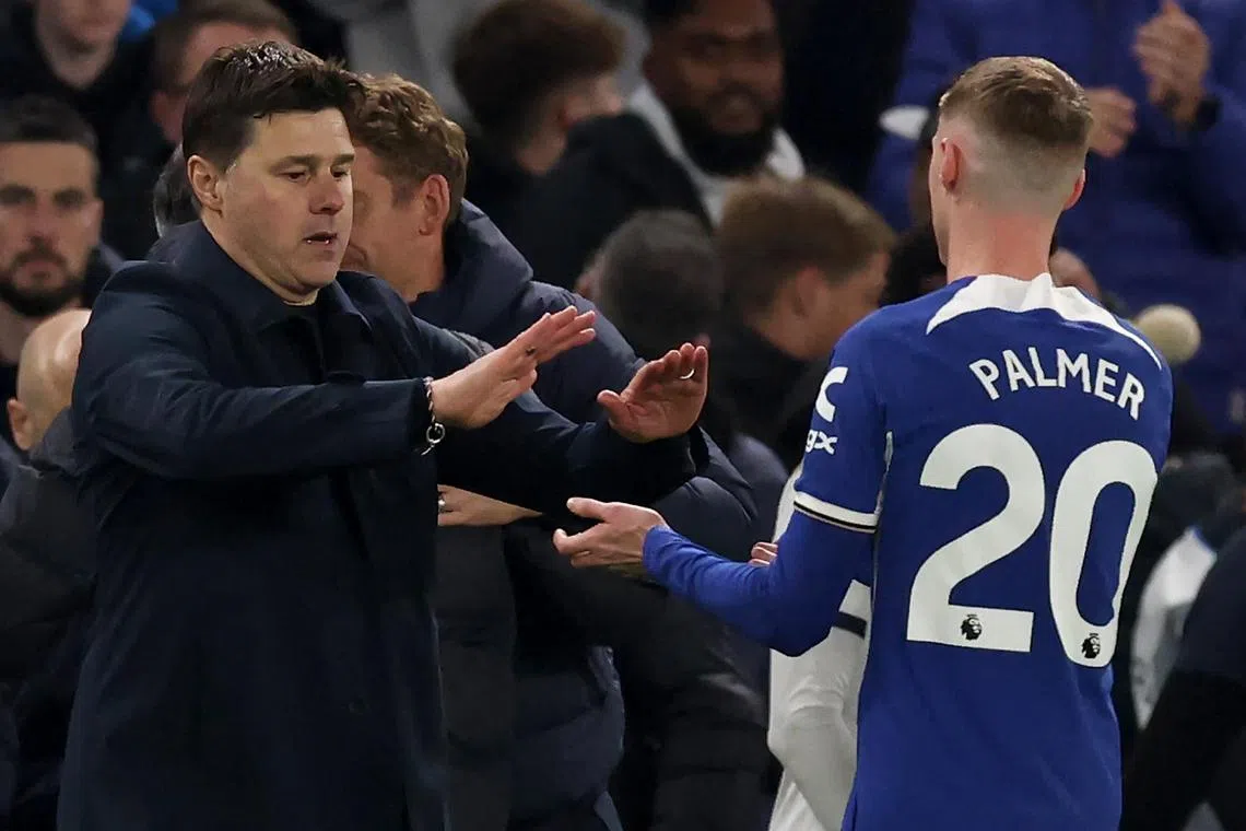 Chelsea manager Mauricio Pochettino (left) with Cole Palmer during the EPL match with Tottenham on Thursday. Chelsea won 2-0 to move up to 8th in the table.