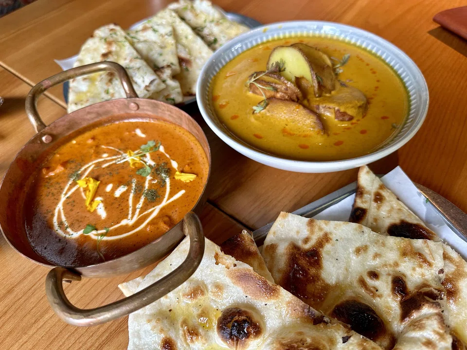 Butter chicken and potato aloo dum with assorted naan.