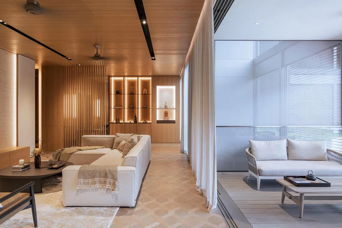 design11 - The parents’ unit features lighter wood tones, with new shelves and cabinetry in the living area allow the parents to showcase objects. The parents’ unit features a low television console and light-toned wallpaper. There is a raised, multipurpose platform in the first bedroom of the parents’ unit. A new screen provides some privacy at the parents’ foyer.

