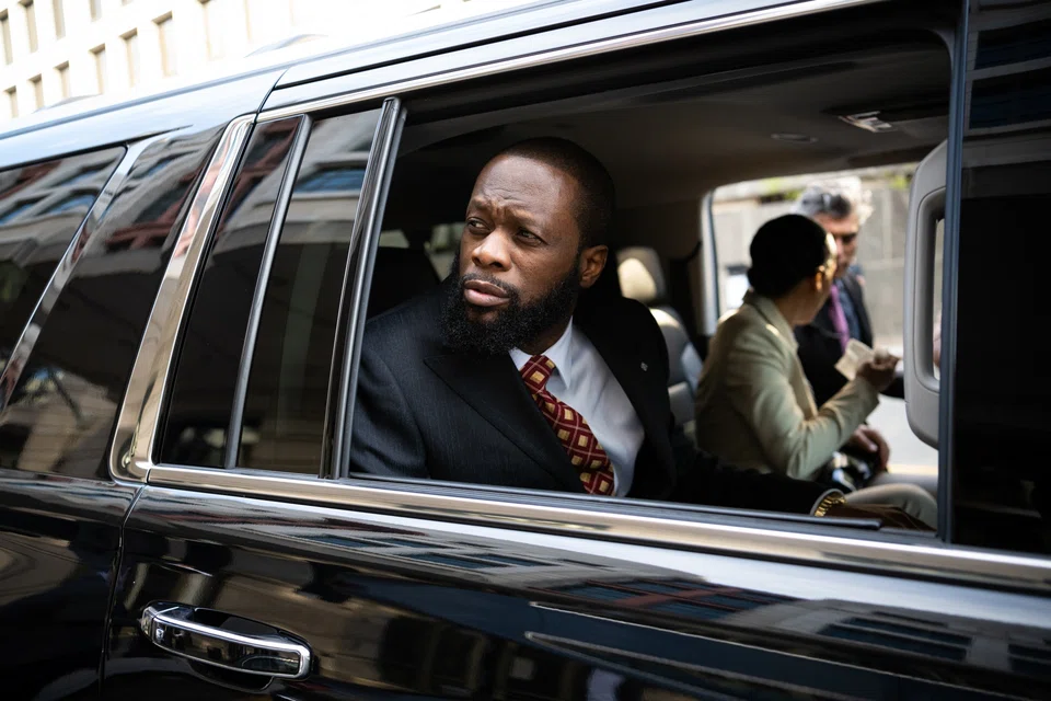 Pras Michel told a federal jury in Washington that Jho Low hired him to be a “celebrity surrogate” to get the photo.