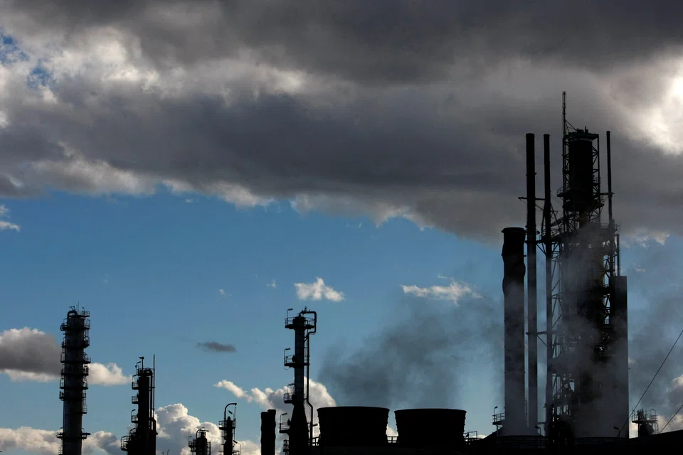 Emissions from an oil refinery in Melbourne. Corporates have boosted their environmental disclosures, including carbon emission and reduction targets.