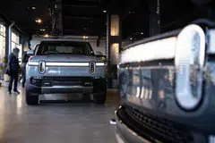 Rivian says it expects to sell between 46,000 and 51,000 EVs this year, below the roughly 54,800 average of analyst estimates compiled by Bloomberg.