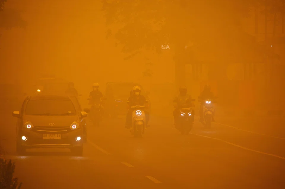 Haze from wildfires shrouds a motorway in Palangka Raya, Central Kalimantan province, Indonesia, Oct 14, 2026.