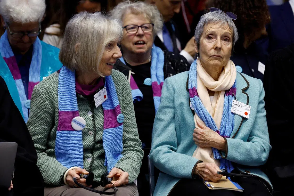 Rosmarie Wydler-Walti (left) and Anne Mahrer, of the Swiss elderly women group KlimaSeniorinnen, attend the hearing for the ruling in their case against the Swiss government.