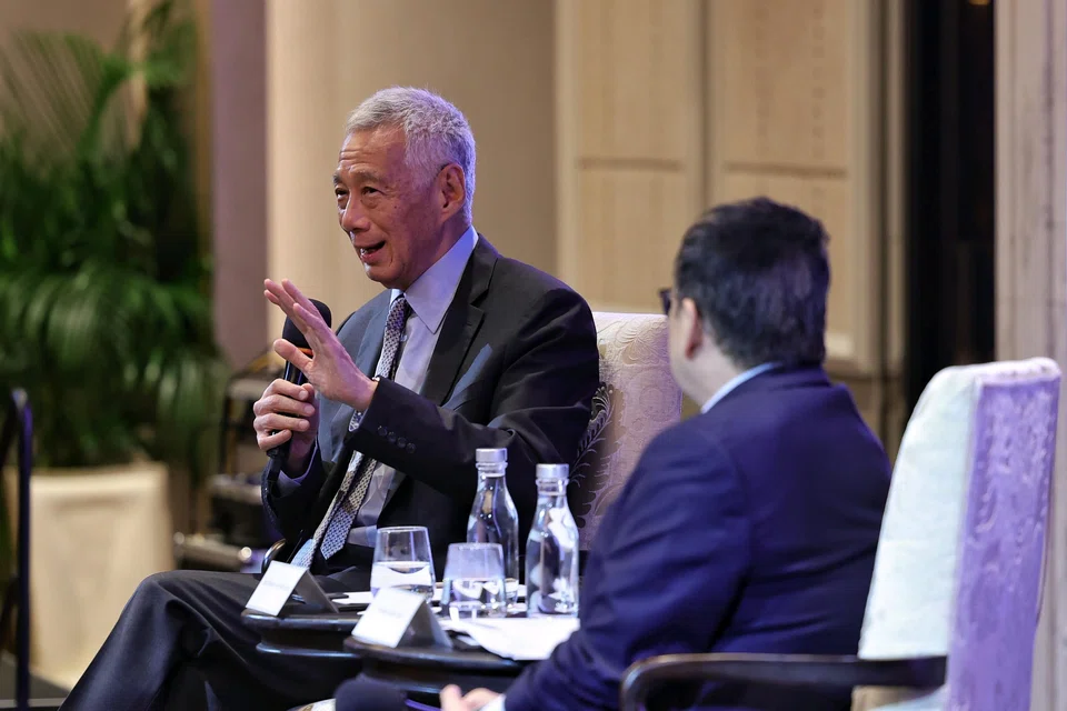 Senior Minister Lee Hsien Loong (left) was speaking at the Economic Society of Singapore's annual dinner on Jul 15, with the society's president Euston Quah.