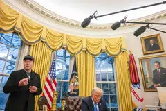 Tech billionaire Elon Musk speaks as US President Donald Trump looks on in the Oval Office of the White House in Washington, DC, Feb 11, 2025. Musk, who has been tapped by Trump to lead federal cost-cutting efforts, said the United States would go "bankrupt" without budget cuts. 