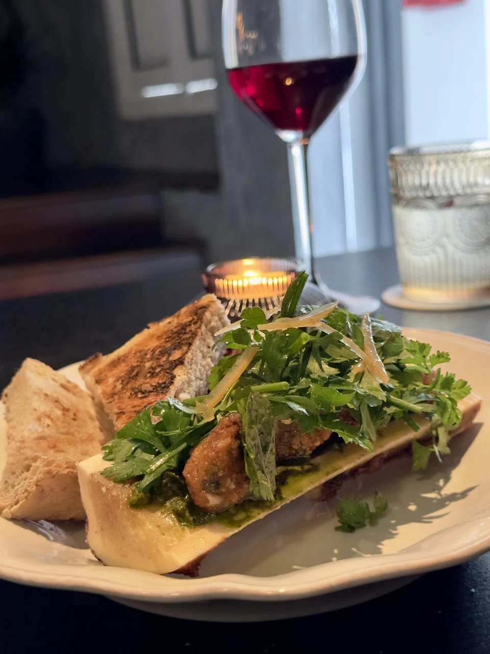 Rich bone marrow and escargot are topped with a refreshing parsley salad.