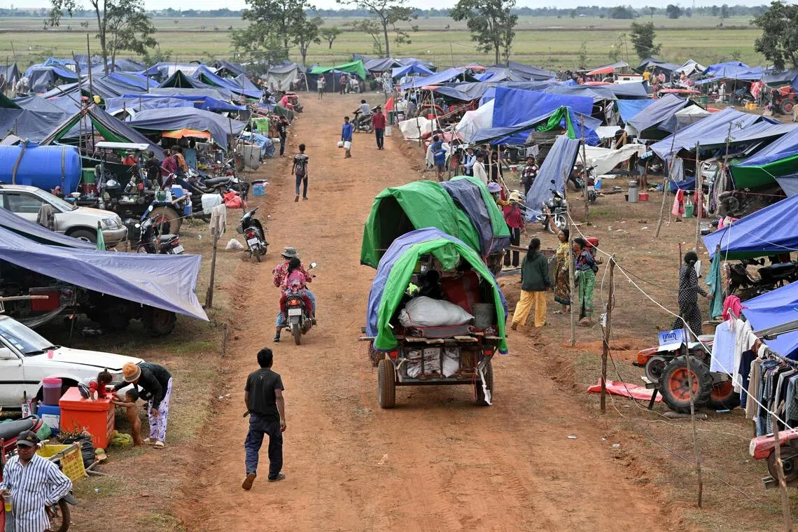 (FILES) Displaced people arrive at a temporary camp in Cambodia's Oddar Meanchey province on December 11, 2025, amid clashes along the Cambodia-Thailand border. Cambodia and Thailand agreed to a ceasefire on December 27, 2025 after three weeks of renewed cross-border fighting that killed around 50 people and displaced more than a million. But many on both sides remained hesistant to head home, citing no official word that it was safe, and their own fears and a lack of trust that their neighbour won't break the truce again. (Photo by TANG CHHIN Sothy / AFP)
