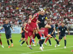 Singapore's Shawal Anuar (wearing the No 20 jersey) challenging Guam's Jason Cunliffe for the ball in their World Cup qualifier at the National Stadium on Oct 12.