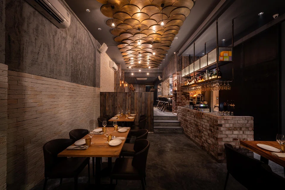 The rustic interiors of Il Toro Woodfire Grill.