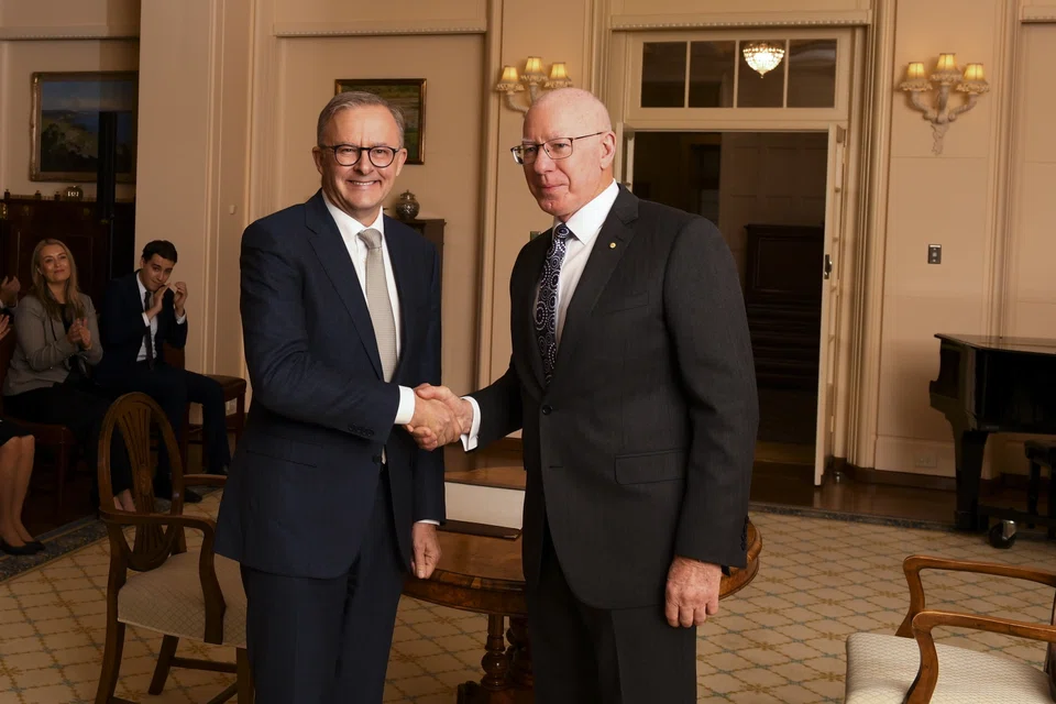 Newly sworn-in Australian Prime Minister Anthony Albanese (left) shakes hands with Australian Governor-General David Hurley  during a swearing-in ceremony at Government House in Canberra, Australia, May 23, 2022.