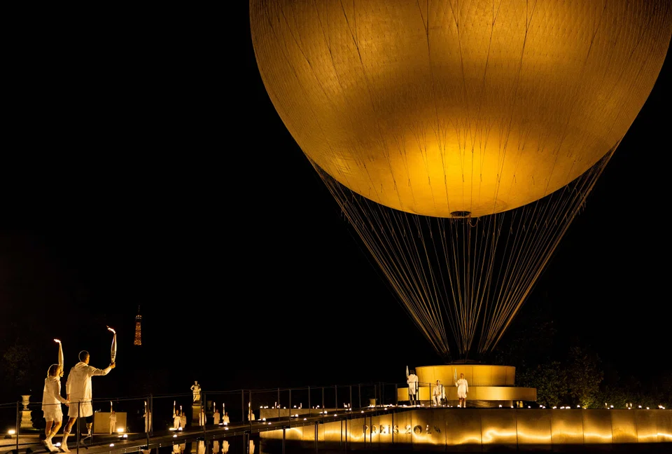 (From left) France's paralympic torchbearers, Nantenin Keita, Alexis Hanquinquant join Charles-Antoine Kaoukou, Fabien Lamirault and Elodie Lorandi holding the flame in front of the Paris 2024 Paralympic Games cauldron during the Paris 2024 Paralympic Games Opening Ceremony at the Jardin des Tuileries in Paris, France, Aug 28, 2024.