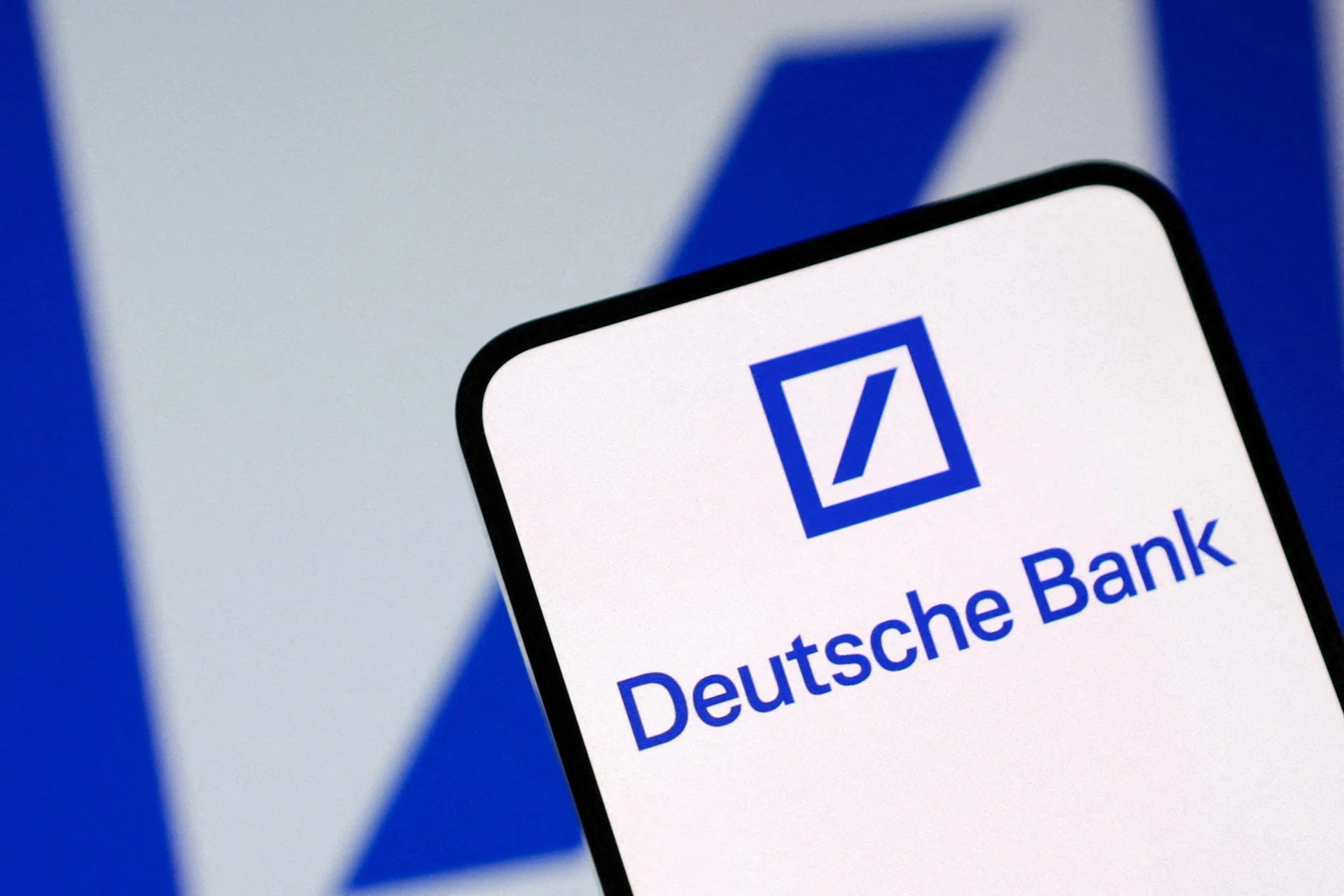 Deutsche Bank posts biggest annual profit in nearly two decades a day after police search
