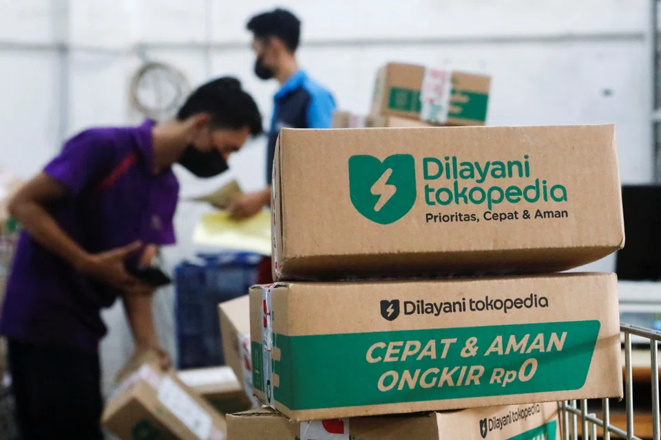 Employees packing goods at Goto's e-commerce unit Tokopedia's warehouse in Jakarta. 