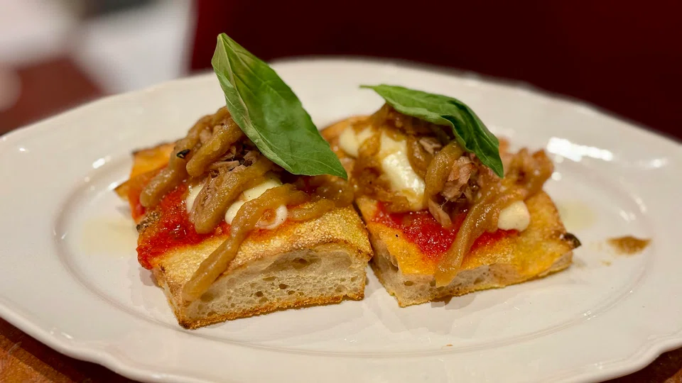 Roman-style pizza topped with tuna.