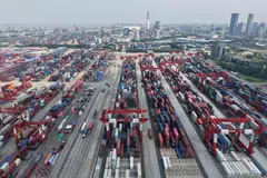 Shipping containers are stacked at a port in Shanghai on June 9, 2025. Chinese exports grew slower than expected in May, according to official data on June 9, as shipments to the United States tumbled amid global trade turmoil triggered by Donald Trump's tariff blitz. (Photo by AFP)