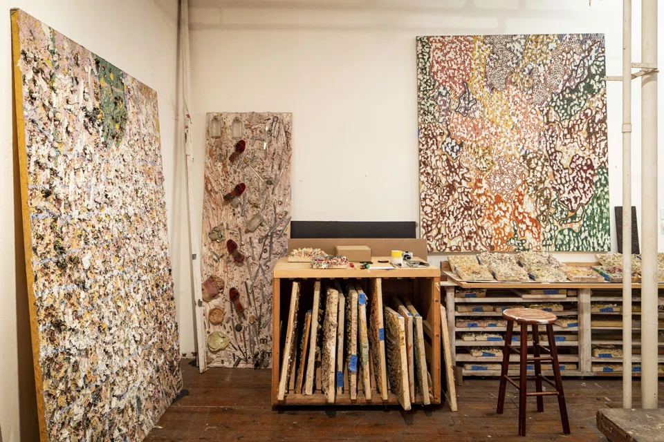 Artwork stored in artist Iria Leino’s loft on Greene Street in New York. Embedded with more than a thousand rocks and pebbles, the 1981 work “The King’s Crown,” far left, weighs almost 200 pounds. 