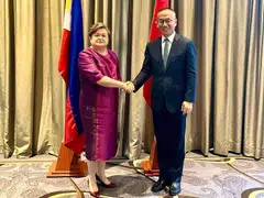 (Left) Philippines' foreign affairs undersecretary Theresa Lazaro and China's vice-foreign minister Chen Xiaodong shake hands during their meeting on the South China in Manila, Philippines, July 2, 2024. 