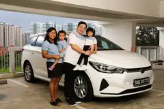 Eric Lim (second from right), who previously owned a Japanese car, bought an electric vehicle from a Chinese automaker after 3 visits to the showroom and 2 test drives.