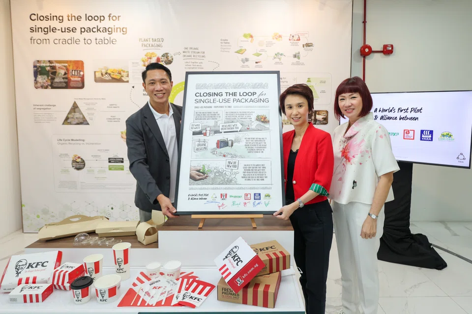 (From left) Ng Pei Kang, CEO of TRIA, Low Yen Ling, Minister of State for Trade and Industry, and Lynette Lee, general manager of KFC Singapore at the launch of the pilot programme between Singaporean startup TRIA and KFC Singapore which will implement a circular recycling model for single-use packaging. 