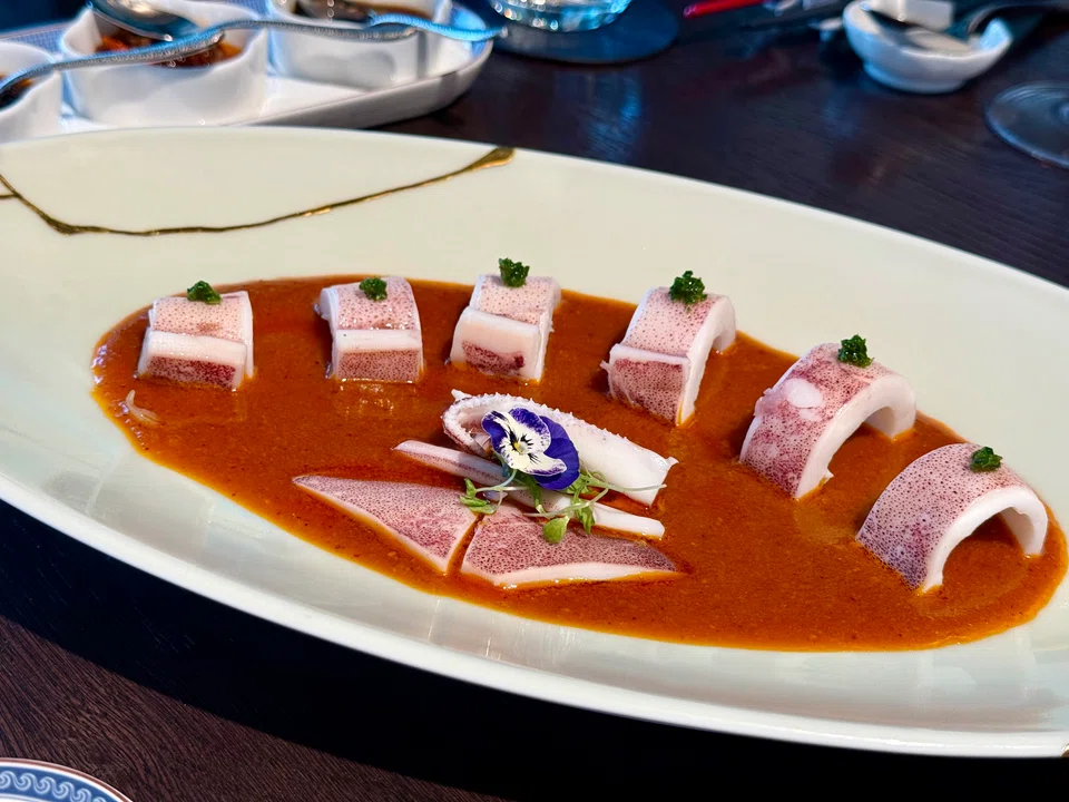 Poached Hokkaido squid in peanut chilli oil sauce.