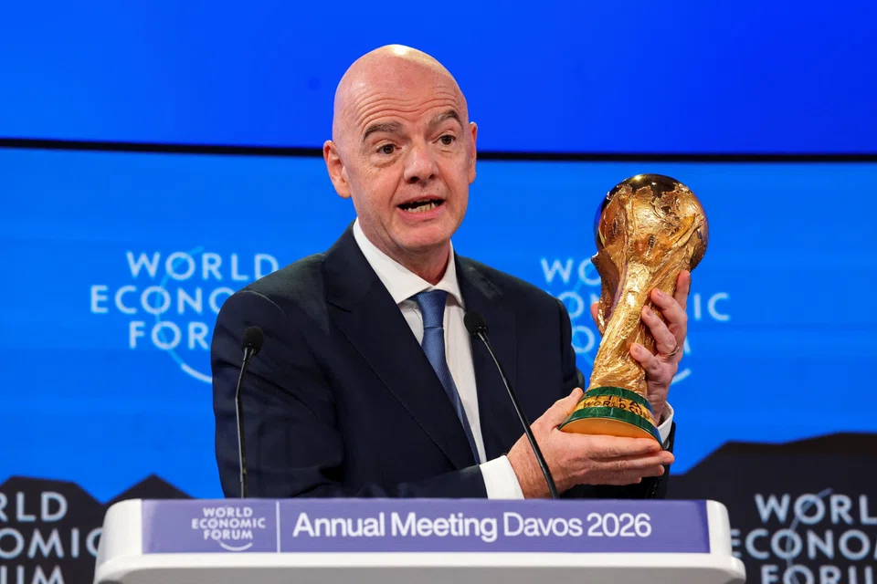 Gianni Infantino with the World Cup trophy in Davos, Switzerland.  The Fifa president has defended the sky high ticket prices, citing unprecedented demand and the revenue generated for football around the world. 