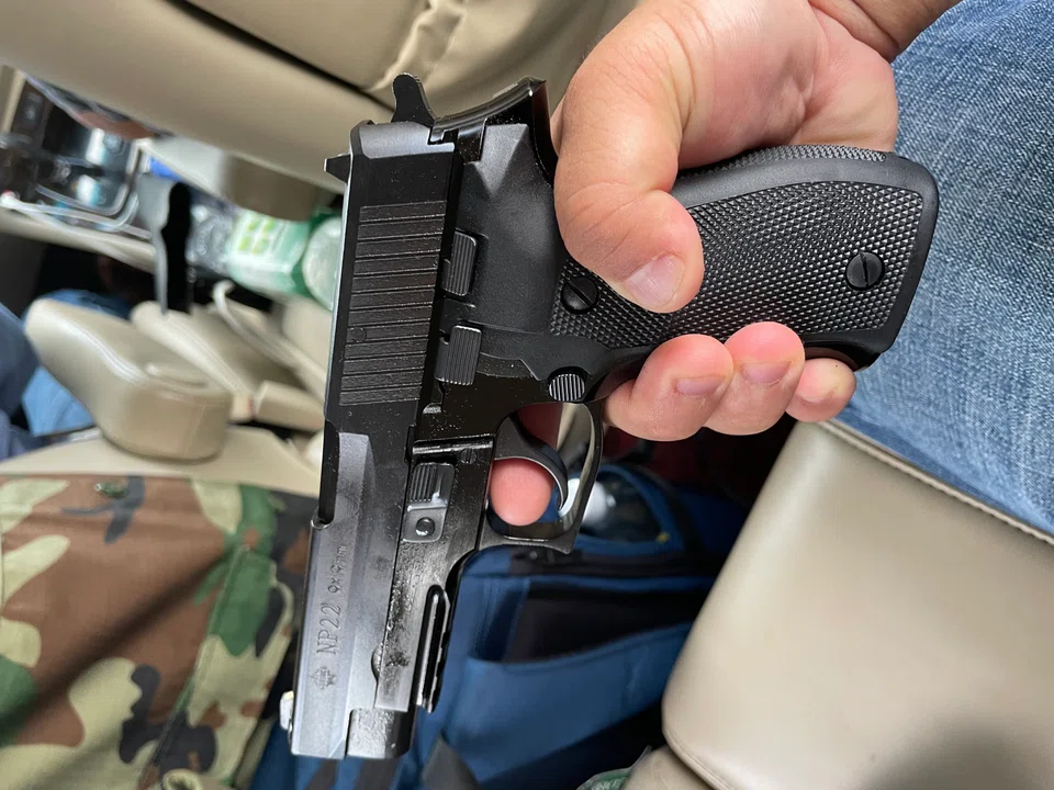 With guns being common in Sihanoukville, the driver hired by the reporter himself carries a China-made NP22 pistol for self defence.