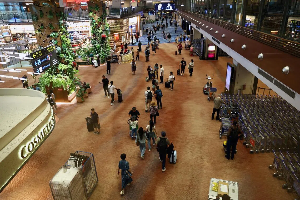 Travellers at Changi Airport. The resurgence of tourism has led to increased acquisition activity in Singapore's hospitality sector.
