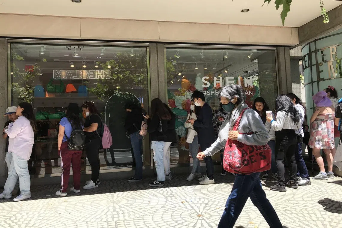 Customers queue at a Shein pop-up shop in San Francisco, June 2022. 