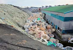 Sacks of untreated and shredded plastic waste, which is left unattended, are piled at an inoperational recycling site in Asan, South Korea, Nov 19, 2024.